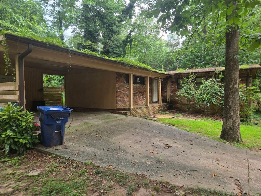 Great Southeast Atlanta Location near Brownsmill Golf Course. Older home in a nice neighborhood where lots of renovations are being done. This one may require a full rehab. Brick home with a two car carport and corner lot. Please enter with CAUTION!!! No electricity so show during day light hours. Property being sold "as is" "where is" with all faults. Again use caution upon entering!!! No Blind Offers!