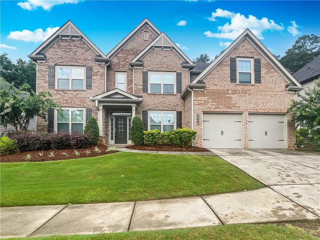 Available September 10th! Beautiful, feature rich 5BR home near downtown Woodstock. Dramatic 2-sty entry Foyer w/Living Rm to the left and a bright Dining Rm rt w/Trey Ceiling and Wainscoting. Ahead is a huge, 2-sty Great Rm w/Stone FPLC, Built-in Bookcases and open views to the Breakfast and Kitchen areas. Kitchen has a lg Bkfst Counter Island, Abundant Cabinets, Walk-In Pantry, SS Appliances and more. Sunroom is adjacent the Kitchen too. This level also boasts Hardwood Flrs in all public areas. a BR on Main, Full Bath and an Office, Mudroom w/Cabinets and a 2-Car Garage. Upstairs are 4 more BR's for a total of 4BR's. Two share a Jack n'Jill Bath and One BR w/pvt Bath. One of the largest Master Suites you've ever seen w/Huge BR and Huge Sitting Area. The Master Bath includes a Walk-In Closet, Dbl Vanities, Garden Tub, Tiled Shwr w/bench and access to the Laundry Room. Wait, there's more - the Patio has a 2nd Fireplace!