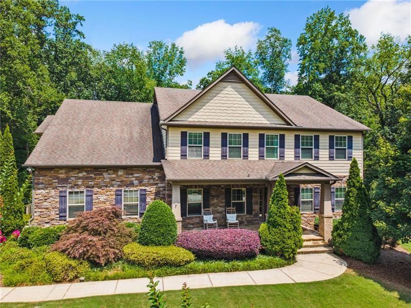 Imagine yourself living in the highly sought-after Hamilton Creek community, nestled in this dream home—an extraordinary 6BR/5BA estate on .72 acres with creek access! Located in prestigious West Cobb County, this stunning property offers privacy, luxury, and room to roam. A dramatic two-story family room with arched doorways flows into a bright sunroom and a gourmet kitchen featuring espresso cabinets, new Quartz countertops, new stainless steel double oven, stove, microwave, and an extra-large custom island—perfect for meal prep and entertaining.
The main-level bedroom with full bath is ideal for guests or multi-generational living. The luxurious owner’s suite includes a private sitting area, oversized walk-in closet, private deck access, and direct entry to the laundry room. The finished basement offers in-wall A/V wiring, a custom stone bar with granite top and wine fridge, and a 500-bottle wine closet with custom iron door. A music room with double-wall sound attenuation adds flexible space.
Outside, enjoy a resort-style in-ground pool with double water features, a spacious pool deck, professional landscaping, and multi-zone irrigation—additional features: new LVP flooring, fresh paint, and LVP throughout. Garage is set up with EV Charging station. This one-of-a-kind estate blends elegance, functionality, and serenity, just minutes from top-rated schools, parks, and shopping. This property is immaculate, well-cared for, and ready for new owners.