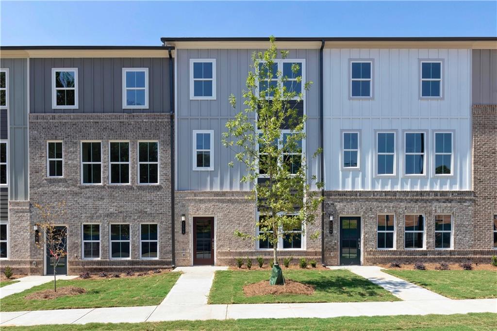 Stanley Martin Homes presents The Quinn, a beautifully designed 3-level townhome that blends modern style with everyday functionality. This open-concept layout features a bright, spacious kitchen with a large sit-down island—ideal for casual meals, entertaining, and holiday gatherings. The family room with fireplace invites relaxation, while the expansive rear deck provides the perfect outdoor space for hosting or unwinding.
Upstairs, you'll find two generous secondary bedrooms, a full hall bath, and a well-appointed laundry room. The private primary suite serves as a true retreat, complete with a large walk-in closet and an en-suite bath designed for comfort and convenience.
The lower level includes a flexible recreation room—ideal for a home office, media room, or additional living space tailored to your needs.
Located in Lawrenceville, GA, just minutes from the Mall of Georgia, this home offers unbeatable access to shopping, dining, entertainment, and major commuter routes. The Quinn is a stylish and practical place to call home.
Photos are of a similar finished home. Estimated completion month is September. Contact us today to schedule your tour!