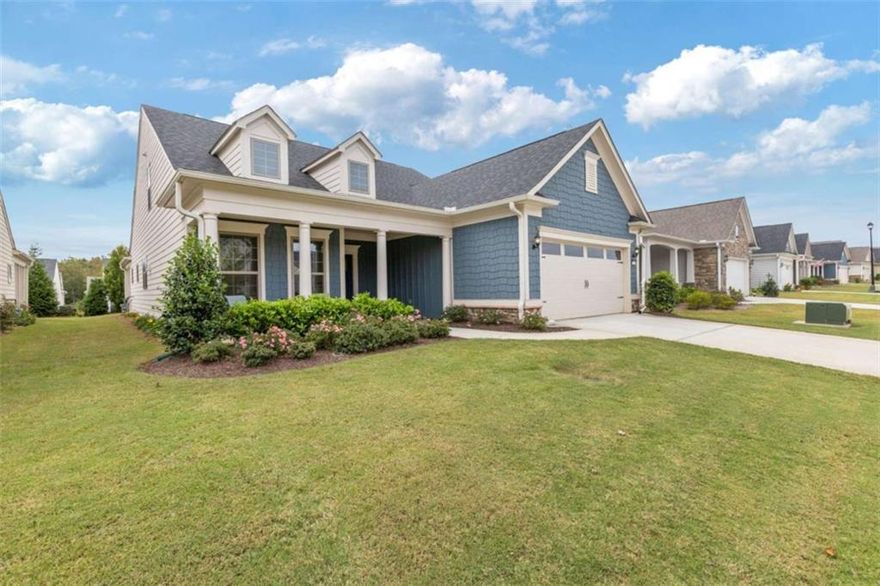 Spacious Open Floorplan, Luxury Upgrades, and 3 Cozy Outdoor Living Spaces make this house a perfect choice!  No need to downsize! This stunning 3-bedroom, 3 bath beauty is the perfect space for entertaining and comfortable living while offering you an abundance of storage options. Step inside to be greeted by like-new, luxury vinyl plank floors that flow seamlessly throughout the living areas, a perfect flex space for home office or study, and a cozy fireplace creating a warm and elegant ambiance.  The gourmet kitchen boasts a dedicated butler's pantry, a grand island as well as endless cabinets providing ample storage & prep space for all your culinary adventures. Adjacent to the kitchen, enjoy a primary ensuite graced with natural sunlight and beautiful finishes, a guest bedroom and full bathroom with tiled floor and shower as well as a thoughtfully designed mud room complete with a sink & built-in cabinets-ideal for keeping your home organized and tidy.  Travel upstairs for space galore!  Here you can enjoy a private guest bedroom with walk-in closet, a 3rd full bath, an oversized loft which can be used as a media room or for entertaining guests, a sewing room, and the massive unfinished walk-in storage room.   Enjoy relaxing afternoons on the classic rocking chair front porch, or host gatherings in the large screened lanai that overlooks the backyard. The outdoor patio expands your living space, offering the perfect spot for barbecues or quiet evenings under the stars.  Finally, Car enthusiasts and golf lovers will appreciate the extended golf cart garage, providing plenty of room for vehicles, hobbies, and storage. WOW!! 36 feet make up this garage space which allows for 3 cars AND a golf cart to fit here!    Everything has been thought of! This home even offers windows adorned with electric blinds, plantation shutters and blackout curtains! With its blend of luxury finishes, functional spaces, and inviting outdoor areas, all within this amenity activity filled 55+ community;you have found the ONE!