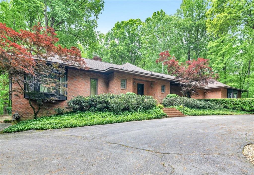 SUBURBAN OASIS!! Private and Gated property entrance on nearly 5 acres with Lake access and Perimeter overflow Koi Ponds. Upscale, custom home in prestigious Lake Spivey community. Fully Renovated and open concept. Finished theatre room in basement w/full bath in main home. Floor to ceiling windows allowing plenty of light. Smart Kitchen and master on main level. Luxury amenities throughout! Heated pool. Pool house or in-law suite fully equipped with it's own kitchen, dining, living room, 1 br, 1b bth, on a full basement.
Easy access to I75/I85, shopping & restaurants.
Your private backyard oasis awaits at this stunning suburban home!