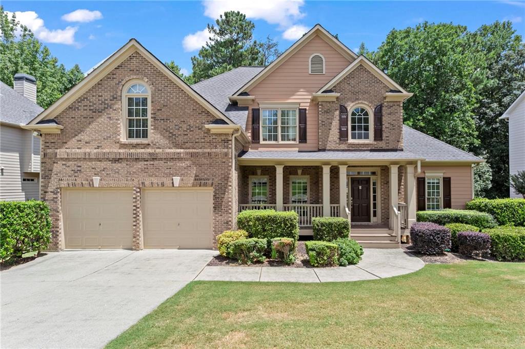 Location! Location! This impressive and spacious 6-bedroom, 4-bath home offers over 4,000 square feet of versatile living space (Tax records do not reflect basement sq ftg)—perfect for large households or multi-generational living. Conveniently located just minutes from Downtown Woodstock, top-rated schools, major highways, and more.
This well-maintained home features a master on the main level, as well as a guest suite with a separate full bath. The dramatic two-story foyer and soaring great room, featuring a gas fireplace, Palladian windows, and casement windows throughout, flood the home with natural light. The updated kitchen includes new stainless steel appliances with an easy-to-clean smooth cooktop, granite countertops, and a breakfast bar. The eat-in kitchen, with its cathedral ceiling, overlooks the private, partially wooded backyard and offers access to the oversized deck. The primary bedroom also has deck access, a natural light-filled walk-in closet, and a well-appointed en-suite bathroom with double vanities. Upstairs, you’ll find three spacious bedrooms, including a bonus room/bedroom with a closet and additional storage space, as well as a Jack-and-Jill bathroom. The fully finished, daylight walk-out basement features a media/family room, a grand-sized bedroom with an attached office, an oversized full bath, glass-front custom-built-ins, generous storage, and a perfectly sized workshop for the DIY enthusiast, with additional flex space for expansion. —an ideal setup for entertaining or a future in-law suite. A space initially designed as a sound booth can be easily converted into a mini kitchen or bar. The basement opens to a covered terrace-level patio. This move-in-ready home has been well-maintained. Discover why Arbor View is one of the premier neighborhoods in Woodstock, and explore the newly updated, first-class amenities, including swimming and tennis facilities, nature trails, playgrounds, and more—all within the River Ridge award-winning school district and just minutes from downtown Woodstock, dining, shopping, schools, and major highways.