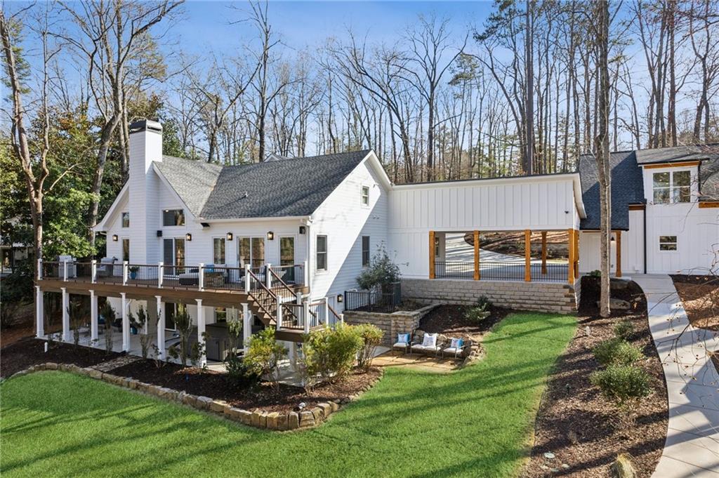 Luxury Lakeside Living – A Rare Opportunity You Need to Experience in Person
Tranquility, Space & Breathtaking Views—This Lake Lanier Gem Has It All
Stop scrolling—this is the lake property you’ve been dreaming about. If you’ve only viewed the photos, you’re missing the full experience. This home is even more stunning in person, with panoramic lake views and peaceful surroundings that simply can’t be captured on camera. Come see it for yourself—before someone else claims your spot by the water.
A Private Escape in a Prime South Lake Lanier Location
Nestled on 2.2 serene acres in Forsyth County with no HOA, this luxury retreat offers rare privacy and endless flexibility. Build your dream pool, an outdoor kitchen, a workshop or second garage—there’s room to make it truly your own. Located minutes from Young Deer Park, GA 400, City of Cumming with Shops, Restaurants and Entertainment close-by. Northside Hospital and great Forsyth County Schools. You’ll enjoy peaceful seclusion without sacrificing convenience.
Lake Views from Nearly Every Angle
The open, light-filled layout is perfect for entertaining or relaxing by the water. Gather around the oversized kitchen island, unwind in the spa-inspired primary suite with heated tile floors, or take in stunning lake views from the upper deck.
Upstairs, a private guest suite offers added comfort and quiet—ideal for visitors, family, or a work-from-home haven.
Soak in the Outdoors—Every Single Day
From the gentle, level walk to the shoreline with a permitted mow permit to the inviting hot tub under the covered patio, every outdoor space is designed for rest and recharge. The double-slip dock with two HydroHoist lifts sits in deep, clear water—ideal for boating, lounging, or floating the day away.
Bonus Living, Endless Potential
The detached 3-car garage includes a finished 900 sq. ft. guest suite with its own full bath and lake views—perfect for hosting, hobbies, or creating the ultimate home office or studio.
Everything You Need for Effortless Living
From a home generator to a large storage shed and ample parking, every detail has been thought through so you can enjoy lake life with ease and style.
This Isn’t Just a Home—It’s a Lifestyle
Peaceful mornings. Sunset cruises. Laughter around the fire pit. This is the kind of place where memories are made—and they’re waiting for you.
Don’t wait—Schedule your private tour today and step into your lakeside escape.