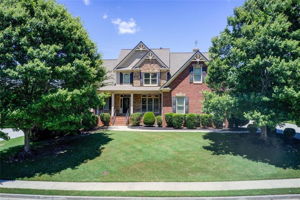 Welcome to Your Dream Home at Heritage at Grayson! This magnificent custom residence is a beautifully maintained 4-sided brick home situated in an active swim, tennis, and clubhouse community. As you approach the property, you'll be greeted by a charming front porch and a side-entry three-car garage. Step inside to discover a spacious and bright floor plan featuring 5 bedrooms and 3.5 elegantly appointed bathrooms, offering exceptional comfort and style throughout. The home boasts hardwood floors and carpet, a large kitchen equipped with granite countertops and a breakfast area that seamlessly opens to the inviting keeping room which has a fireplace. Additionally, you'll also find a generous living room with a fireplace, a separate formal dining room, and an unfinished basement which is stubbed for bath upgrade that presents an exciting opportunity for customization - ideal for a fitness area, home theater, or additional living space. Located within a top-rated school district, this property is in a friendly neighborhood with close proximity to shopping, dining, parks, and medical facilities. Enjoy easy access to US-78, I-85, and 316, as well as the vibrant restaurants in downtown Grayson. Additional highlights include a family keeping room with coffered ceilings and double French doors in the Living Room leading to the deck level, as well as a primary bedroom conveniently located on the main floor. This property is not just a home - it's a lifestyle. Don't miss the opportunity to make this stunning estate yours! Schedule a private showing today and discover the perfect place to call home!