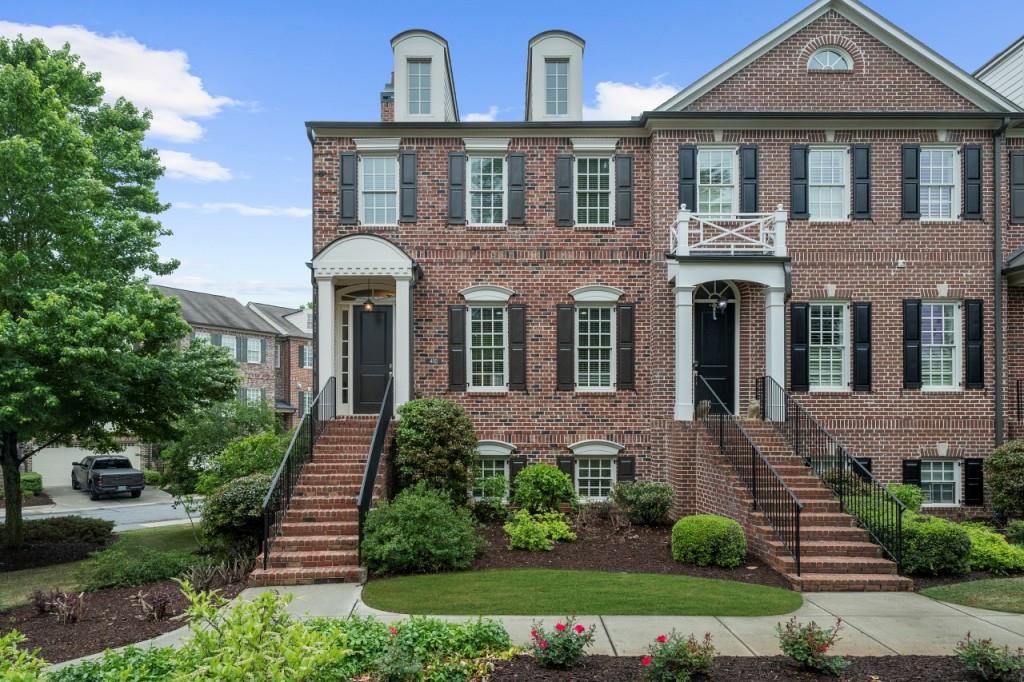 Discover the perfect blend of elegance and vibrant city living in this stunning 3-bedroom, 3.5-bath corner townhome at The Georgian, steps away from the buzzing heart of downtown Alpharetta. Come inside to an open-concept masterpiece featuring gleaming hardwood floors on all 3 levels, a cozy fireside family room wrapped in chic shiplap, and a gourmet kitchen with updated cabinetry designed to dazzle your guests. With serene views of the lush front lawn, this space effortlessly invites you to unwind or entertain in style. Retreat upstairs to the luxurious primary suite, boasting a custom walk-in closet as functional as it is fabulous. The versatile lower level transforms to fit your lifestyle whether you crave a media haven, a sleek home office, a lively game room, or an extra bedroom (with full bath!). With plenty of storage and a spacious garage, every inch of this home is designed for convenience and sophistication. Plus, water and sewer are included, making life here even easier. Step outside and immerse yourself in the vibrant Alpharetta scene just a short stroll to the lively farmers market, the electric atmosphere of concerts on the lawn at Brooke Street Park, mouthwatering dining at fantastic restaurants, and the ever-popular Food Truck Alley. This rare rental gem offers an unbeatable combination of upscale finishes, flexible living, and an unbeatable location, delivering the ultimate lifestyle where comfort meets excitement.