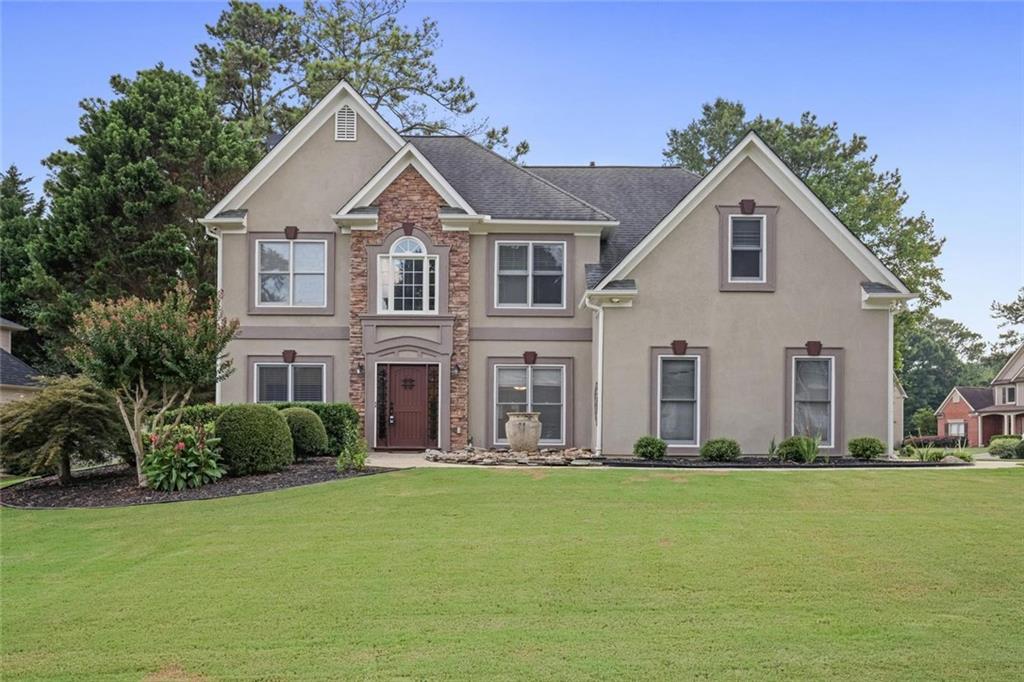 Come see this beautiful 4 bedroom/ 3 bath home located in the quiet, highly sought after Cameron Park subdivision. This home sits on a .3024 acre level, corner lot, and is well landscaped and has a long driveway. Walking into the 2 story foyer home, you will see an office/ flex room to the left and spacious dining room to the right. Further into the home is a 2 story great room with a stone fireplace. There is new flooring in the great room, kitchen, downstairs bedroom and new tile in the full downstairs bathroom. The kitchen opens to the great room, has granite countertops, and stainless appliances. There is a pantry in the eat in kitchen area that leads to the fabulous sun room with windows galore! On the first floor there is also a bedroom, full bath and laundry room. Upstairs are two, spacious, secondary bedrooms and a very spacious owner’s suite with a sitting room and tray ceilings. There is new flooring in bedrooms and baths in the upper level. There is also a second laundry upstairs. Additional improvements to the home include new water heater (2024), new paint – interior and exterior (2024/2025), new downstairs AC unit (2019), updating of many of the fans and lighting throughout the house, painted the garage floor (2025), and new fence. Amenities include swimming pool, tennis court, picnic area, and clubhouse. Convenient to I 75, Hwy 41, Marietta Square, Kennesaw Mountain National Park, Kennestone Hospital and Walker School.
