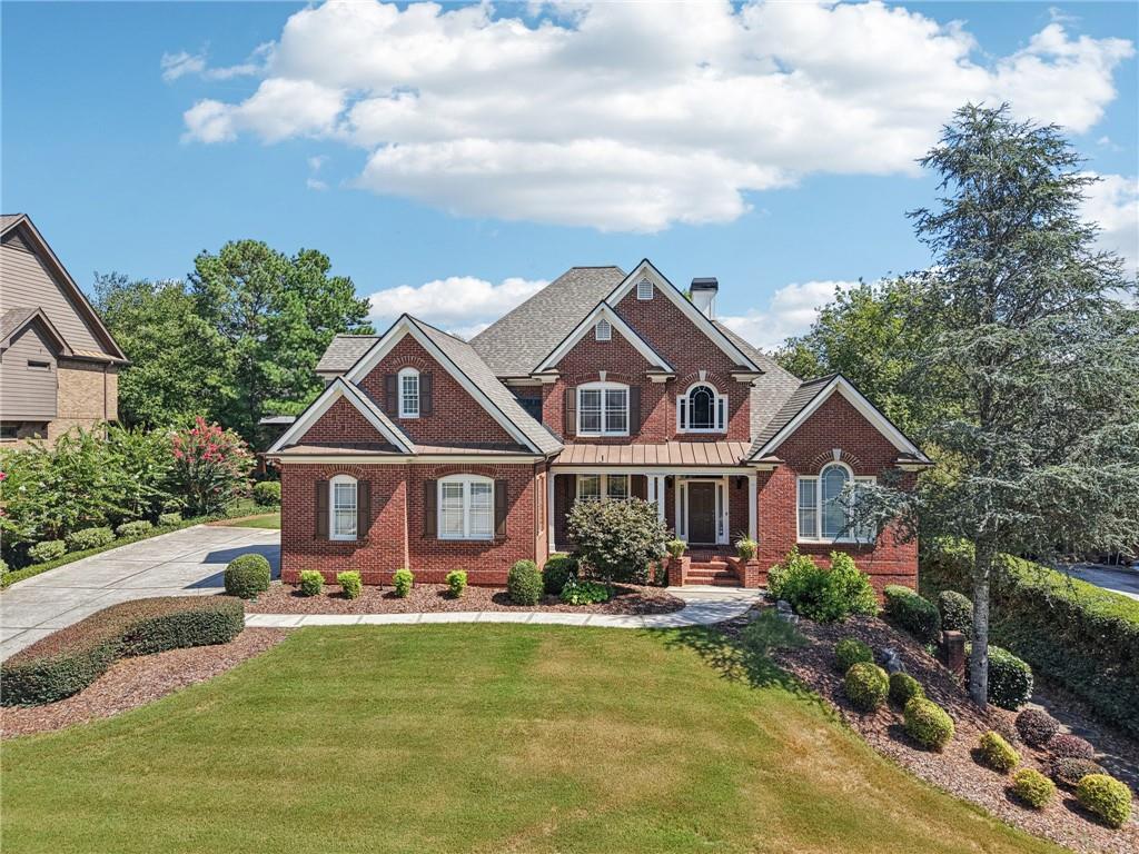 MUST SEE! Traditional home in the gated community of Havenstone, featuring a master-on main floor plan, with an additional bedroom and bath on the main level. HUGE gourmet eat-in kitchen with a butlers pantry, open to the 2-story family room with beautiful floor to ceiling windows. Friendship door leads to the large mudroom/ laundry. Upstairs are 3 large bedrooms and a shared bath. The full finished basement has an in-law suite, kitchenette, movie room, game room, and workout space. Private, flat back yard. Neighborhood amenities include a security guard manned gate, tennis courts, ALTA tennis team, Jr Olympic pool, playground, pond, sidewalks and street lights. Located in the award-winning Brookwood High School CLuster!