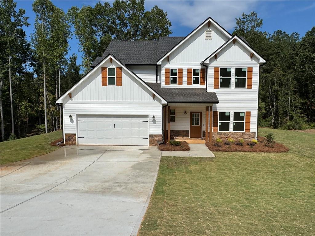 Charming 2-Story Farmhouse on 5 Scenic Acres.Welcome to this stunning 3-bedroom, 2.5-bath farmhouse-style home that blends rustic charm with modern comfort. Nestled on 5 peaceful acres, this beautifully designed residence also features a private dedicated office space, loft area, and an open-concept layout perfect for both everyday living and entertaining. Step inside through a welcoming foyer that leads past a formal dining room, a convenient half bath, and a coat closet, opening into a true chef’s kitchen. Enjoy white cabinetry, a large center island, a farmhouse sink, built-in display cabinet and buffet, modern backsplash, and stainless steel appliances—including range, microwave, and dishwasher. The spacious eat-in kitchen overlooks the family room highlighted by an electric fireplace with a marble surround and a tastefully shipped lap accented wall. Luxury vinyl plank (LVP) flooring runs throughout the main level, complemented by beautiful lighting fixtures and access to a back patio with views of your expansive property. Upstairs, the primary suite impresses with a tray ceiling, eye-catching accent wall, and a generous walk-in closet. The en-suite bath offers a double vanity, large soaking tub, tiled accent walk-in shower with bench seating, and ceramic tile floors. Two additional spacious bedrooms share a full bath and offer ample closet space. A versatile loft area and a dedicated laundry room complete the upstairs living space. Additional features include a 2-car garage with automatic opener and a custom-built hall tree for added convenience and style. This is country living at its finest—don’t miss your chance to make this dream home your reality! TRACT 1 on Survey. $10,000 builder incentive to go toward closing concessions or off the sales price with preferred lender. Home is still under construction so please use caution when visiting. USDA Loan with 100% Financing Available