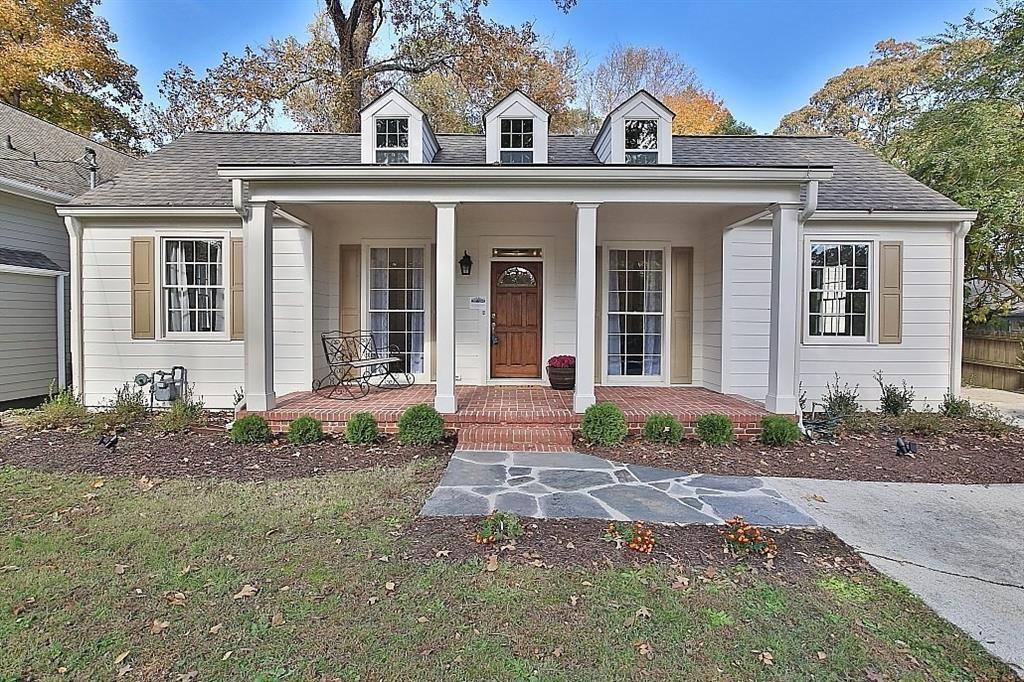 Classic Collier Hills bungalow updated with all of the modern conveniences. Curb appeal galore with an inviting front porch and large windows. The large living room is draped with elegant molding which compliments the high ceilings, fireplace, bookshelves and wide-planked pine floors. The LR transitions to the spacious dining room with a connecting butler's pantry inviting you into the bright, modern kitchen with high ceilings, skylights and large island and modern appliances. Kitchen is open to family room with lots of windows and views to the private backyard and its stone walls and patio. French doors access the yard via the covered deck which is great for grilling. The private and completely updated primary suite offers French doors to the deck, a luxurious bath and oversized walk-in closet. Two other bedrooms on the main floor share a full bath. Upstairs is another private suite with gabled ceilings and full bath. A dry partial basement with concrete floors can be storage, workshop, etc. Walk to shopping, Piedmont Hospital, restaurants, Beltline, Tanyard Park, Memorial Park, Bobby Jones Golf Club, Bitsy Grant Tennis Center.