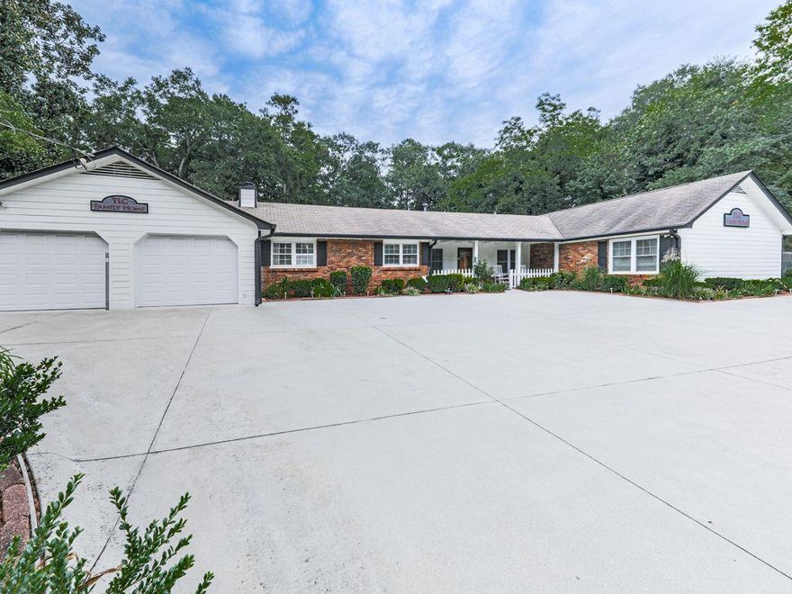 Amazing commercial opportunity in the heart of East Cobb. Updated, stepless ranch features 4-bedrooms, each with ensuite
bathroom, plus a half bath. High visibility and 2 curb cuts on Shallowford Road and a level and fenced .80-acre lot offers tons
of parking and a prime opportunity for a doctor or chiropractor, attorney, insurance agent, daycare, assisted living, or a
myriad of other uses. Average Daily Traffic count of 31,000 cars! Spacious floorplan with Living Room/ reception area, large
Den with masonry fireplace, beautiful eat-in Kitchen, screen porch, 2-car garage, and huge level and fenced backyard. Lots of
updates including roof, Hardiplank siding and exterior paint, 2 HVAC systems, Kitchen, bathrooms, carpet, interior paint,
thermal windows, emergency lighting, insulated garage doors and openers, termite bond, and more. Central Cobb County location is very convenient to all major travel routes, tons of shopping and dining choices, golf,
hiking and biking trails, county parks, Chattahoochee River National Recreation Area, and much
more. Property is available fully furnished if desired. Top tier Cobb County public schools! This is a
one-of-a-kind property in a highly desirable location. Come explore the possibilities!