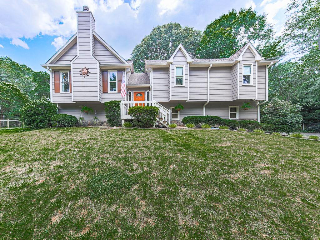 Beautiful home on large lot in quiet neighborhood! Perfect location just minutes to I-575, shopping, great schools, restaurants & downtown Woodstock. The pride of ownership shines through as this home is loaded with special touches. The spacious kitchen has newer slate appliances. Architectural shingle roof is approx. 6 years old. Newer custom back deck with Pergola. All new hardieplank siding. Owner has maintained a transferable Home Warranty which covers appliances, heating & air. Spacious basement is partially finished. Extra insulation has been added in attic & garage. Large fenced backyard extends beyond fence in rear. Don't miss this incredible opportunity.