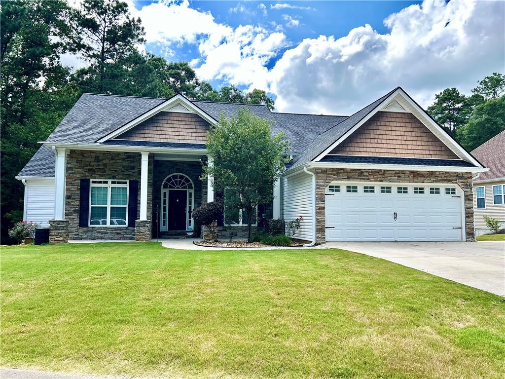 Welcome Home to this lovely ranch home with beautiful rocking chair front porch! You will love the privacy this home offers with just 6 homes in this subdivision, you have a large lot and no traffic driving through! This home offers so much square footage! Over-sized master bedroom with trey ceilings and onsuite with double vanity, separate shower and soaking tub, large walk-in closet and tall ceilings! Huge family room with vaulted ceilings, separate dining room and formal living room. Gorgeous kitchen with tons of cabinets and counter space, breakfast bar and breakfast area. Two spacious secondary bedrooms with large closets. Home also offers a full finished basement, perfect for mother-in-law or teen suite. Terrace level has family room/media room, 3 bedrooms, full kitchen, washer and dryer, exercise room, boat door and storage. You can also sit out on your large back deck and enjoy the peace and quiet or sit under the back patio and relax. With this half acre lot, you have tons of space to add a pool, fire pit or other outdoor living space.