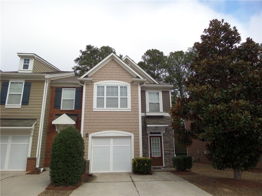 Don't miss out on this rare 2 bed 2.5 bath end unit located minutes from KSU and I-75! The open floor plan provides new hardwoods on the main level and carpet upstairs. The unit features 2 spacious master suites both accompanied by nice size bathrooms which feature garden tubs and separate showers. Laundry room locate upstairs. Water and landscaping included in rent! Community swimming pool. 1 dog under 20lbs will be considered with a $250 non-refundable pet fee.