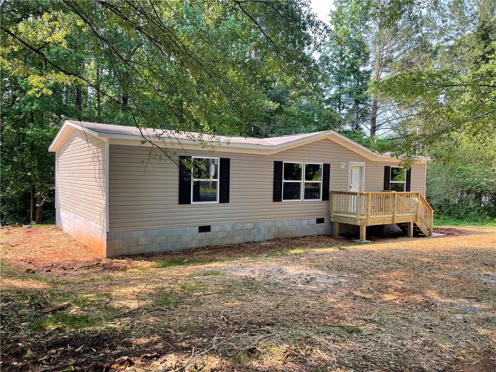 Brand-new 3 bed, 2 bath home on nearly an acre with everything freshly installed—roof, HVAC, appliances, floors, and more. With 1,264 sqft of open living space, it features a split-bedroom layout, large kitchen island, walk-in closet, and modern finishes throughout. Concrete driveway coming soon—just waiting on final power and inspection, and it’s ready to go!