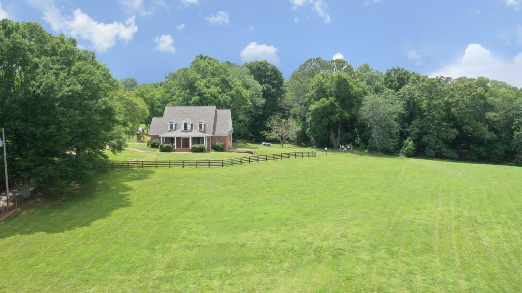 50 +/- acres in a prime Milton location. Close to the Avalon, downtown Alpharetta, and 400. The property has rolling green pastures, a beautiful homesite, and 4 board fencing which offers multiple possibilities - build your dream home or development opportunity (site plan is available). Additional acreage is, also, available - call for details.