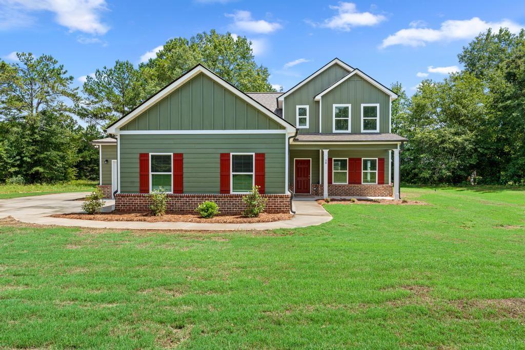 New Construction in Ola School District! This beautiful 4 bedroom, 2.5 bath home sits on 1.256 acres and features the master suite on the main level. You'll love the open kitchen and family room layout-perfect for everyday living and entertaining. Enjoy relaxing on the rocking chair front porch or the covered back patio. A spacious 3-car garage completes the home with extra room for storage or parking. Home comes standard with Color Plus Hardie Siding, Granite Countertops, Wood Tread Stairs, LVP in common areas and bathrooms, carpet in bedrooms and closet. One Year Builder Warranty