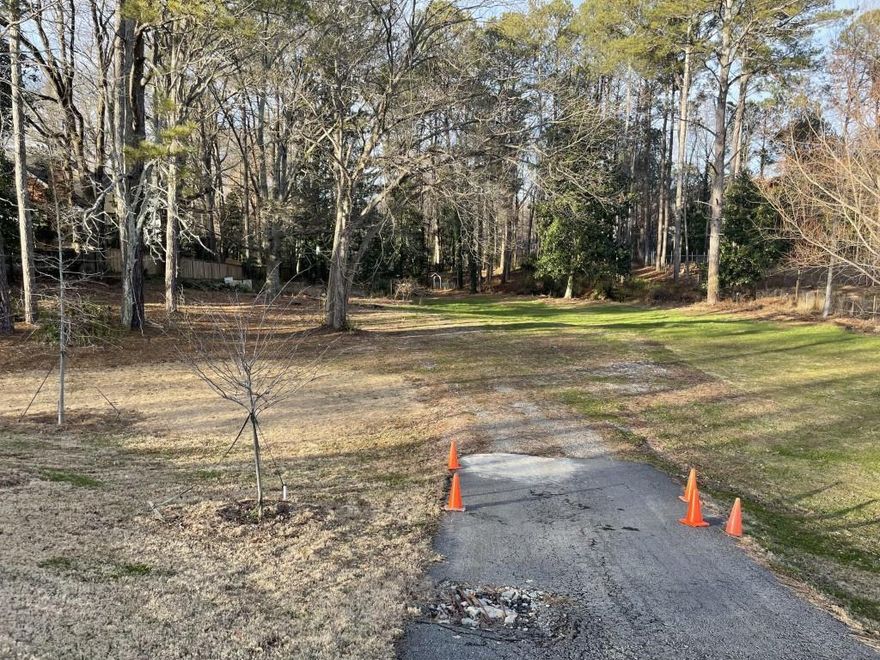 OFFERED BELOW APPRAISED VALUE.  LOCATION  is GREAT. Lof is 1.65 acres in a WONDERFUL  and NICE  neighborhood in Alpharetta .  No Hoa fees. There is a small creek in the back.  Soil test , survey  and appraisals can be provided as per request. In the past there was a mobile hone that was demolished.  The property had a septic tank in use.  There is a small creek running in the back.  In case buyer needs a public sewer there is a possibility to have public sewer having and easement with the neighbor of the right side who was already signed documents to give consent through the county or using a parallel line through the back neighbor with a private easement.