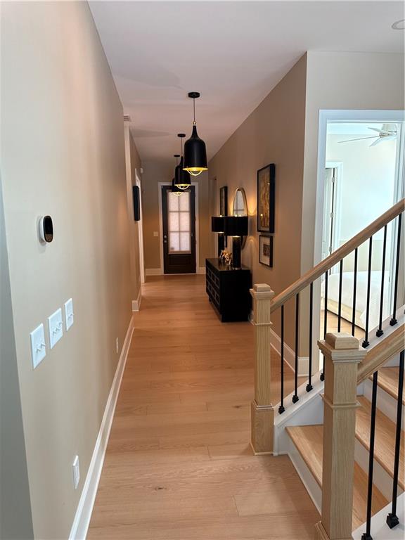 The airy extended foyer of the Juneau Elite is open to the spacious flex room and impressive great room, with views to the desirable covered patio beyond. The well-designed kitchen is complete with a sizable casual dining area, a large center island with breakfast bar, ample counter and cabinet space, and a roomy walk-in pantry. The stunning primary bedroom suite is highlighted by a gorgeous tray ceiling, oversized His and Hers walk-in closets, and a deluxe fully tiled primary bath with dual vanities, a large luxe shower with seat, linen storage, and a private water closet. Secondary bedrooms feature walk-in closets and a shared bath with separate vanity area. Secluded on the second floor, an additional bedroom with a walk-in closet and a full bathroom, a generous loft with a cozy living room. Additional highlights include easily accessible laundry, an everyday entry, a tiled powder room, and plenty of additional storage. Much More to see. This home has been custom designed and decorated. Close to shopping