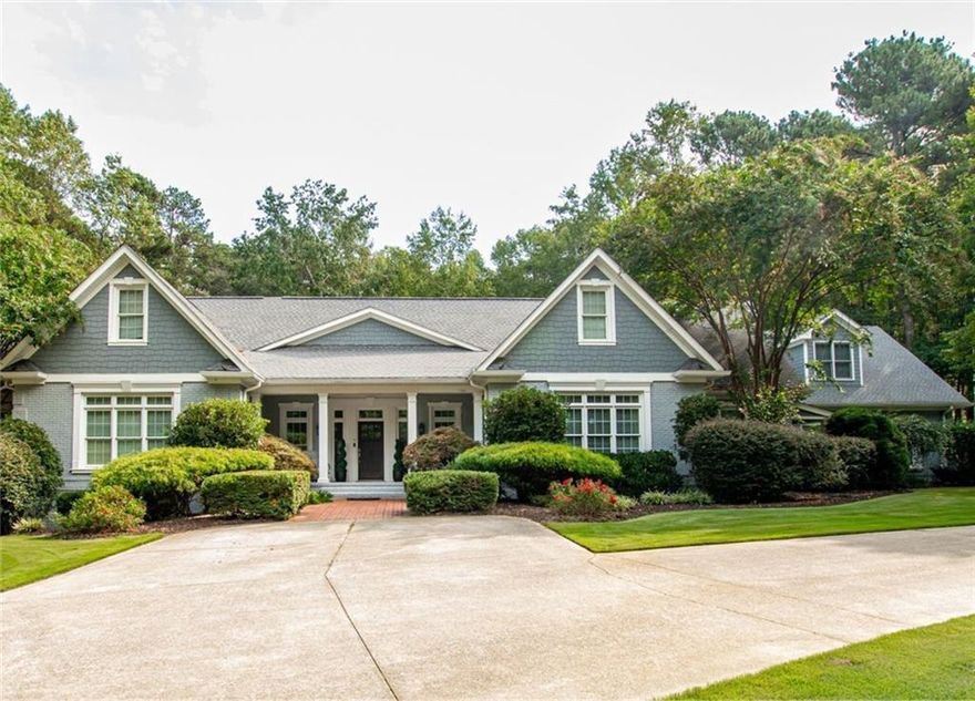 Stunning all-brick estate nestled on a private 2.64-acre lot in Buford, GA. This elegant home boasts 6 spacious bedrooms and 7 luxurious bathrooms with thoughtfully designed living space. This home has a central vacuum for ease and convenience. Main level features a grand Master Suite with heated master bath floor and soaking tub separated from the walk-in shower. An additional bedroom with a private bath on the main level perfect for guests. The gourmet kitchen features stone countertops and stainless-steel appliances with a view to the grand family area. Upstairs, you'll find three generously sized bedrooms, a finished loft area, and ample space for customization. Kickstart a healthier lifestyle with the weight room perfect for strength training, cardio, and everything in between. Relax and feel the fresh air on the back deck overlooking the large backyard. The terrace level is an entertainer's dream, complete with a bar, recreation area, and an additional bedroom and bath with steamed shower. Large windows along back of home for great views of back yard and pool. Step outside to your personal oasis/ pool, featuring a sparkling pool with a cozy outdoor fireplace and an eating area overlooking the pool area. The property is fully gated, offering unparalleled privacy and security, while still being conveniently located close to Mall of Georgia as well as multiple private and public schools. Close proximity to I985 and within one mile of I85 This exceptional home combines timeless elegance with modern amenities, making it a true gem. Don't miss the opportunity to make this your forever home! Book a showing now!