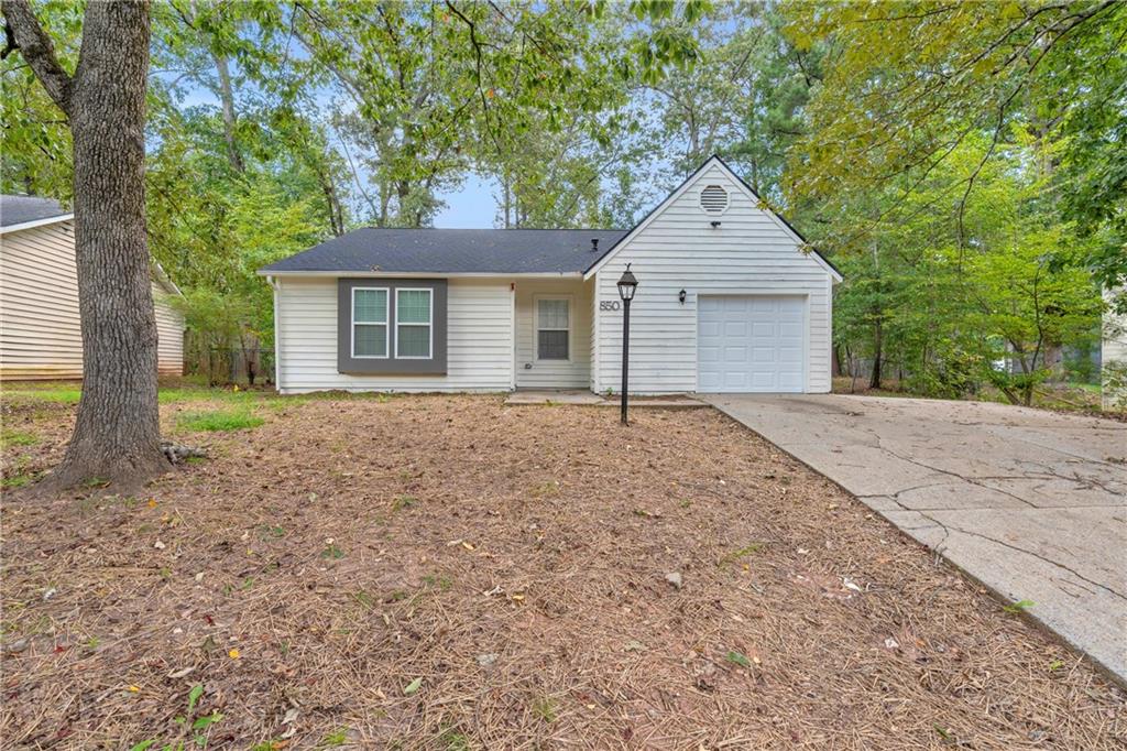 Welcome to Your Dream Home in Stone Mountain! Step into this stunning, fully renovated ranch-style home nestled in the heart of the charming and historic Stone Mountain community. Thoughtfully redesigned from top to bottom, inside and out, this home combines modern finishes with timeless charm—offering all the comforts of new construction without the premium price tag. As you enter, you're immediately welcomed by a custom-built electric fireplace, beautifully framed by a floor-to-ceiling accent wall that adds warmth and style to the living space. The open-concept floor plan seamlessly connects the living, dining, and kitchen areas, creating the perfect layout for entertaining and everyday living. The kitchen is a true showstopper—completely custom-built and designed for both beauty and functionality. Featuring striking granite countertops, a floor-to-ceiling tile backsplash, and a large breakfast island at the center, this space is surrounded by sleek, soft-close white cabinetry that offers ample storage for all your culinary needs. The living room boasts brand-new flooring, soaring ceilings, and recessed lighting that enhances the spacious feel while providing a bright, inviting atmosphere. Just down the hall, you’ll find three generously sized bedrooms, each with brand-new carpet, updated windows, and stylish lighting fixtures. Both bathrooms have been fully updated with modern finishes and thoughtful design. The master suite features soaring arched ceilings, a custom tiled walk-in shower, and dual closets—perfect for a his-and-hers setup. Outside, enjoy a large, level backyard ideal for outdoor gatherings, gardening, or simply relaxing in your private oasis. Located in a quiet, established neighborhood with easy access to major highways, shopping, and dining—this home truly offers the best of both comfort and convenience. Don’t miss the opportunity to make this beautifully remodeled home yours! Schedule your private tour today and experience the perfect blend of style, function, and value. This one won’t last long!