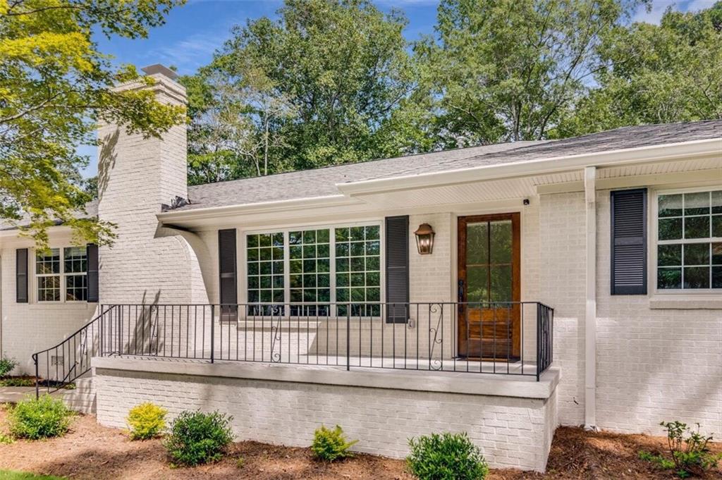 Fully renovated all-brick ranch located in the desirable Longstreet Hills neighborhood. This home features a spacious open-concept kitchen with quartz countertops, an oversized island, and ample cabinet space. The kitchen offers wide plank hardwood floors and views of both fireplaces, creating a warm, inviting space ideal for entertaining. A walk-in pantry includes custom shelving, a barn door, a built-in wine cooler, ice maker and additional cabinetry. The primary bedroom is on the main floor, along with two additional bedrooms and an oversized laundry room. Updates include new HVAC, insulation, ductwork, plumbing, electrical, drywall, trim, interior and exterior paint, and lighting—highlighted by 50 recessed lights throughout. The front porch has been redone with brick and stone, and the home sits on a flat, spacious lot. Enjoy a peaceful setting from the back porch with room for a pool! Located on the Gainesville Trolley route and just minutes from North Georgia Medical Center, Gainesville Square, Wilshire Trails Park, and Lake Lanier, with convenient access to local restaurants, shops, and community events like First Fridays on the Square. Call Alley today for a private tour