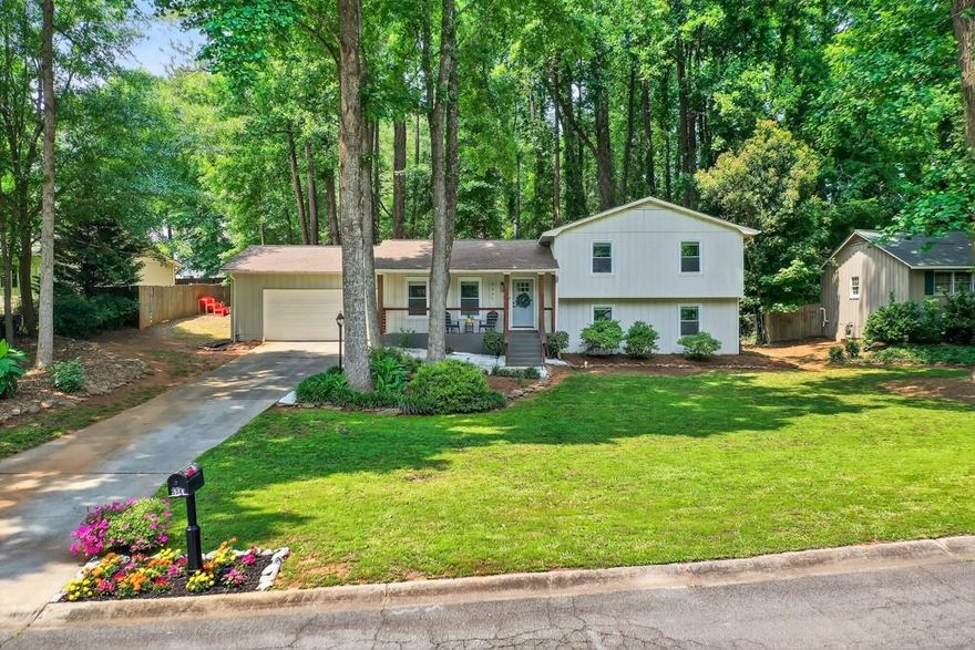 Welcome to this beautifully updated home, nestled in a quiet, established neighborhood in the heart of East Cobb. Located in the coveted Sope Creek, Dickerson, and Walton school district, this move-in-ready property combines timeless charm with modern upgrades—perfect for a young family or couple seeking space, convenience, and style.

Light pours into the home through large windows, highlighting the open-concept living area where the centerpiece is a cozy fireplace framed by custom built-in bookcases—ideal for relaxing evenings or showcasing your favorite decor. The updated kitchen and bathrooms (2023) shine with modern finishes, stainless steel appliances, and durable LVP flooring, all designed for both beauty and function.

Upstairs, the spacious bedrooms offer flexibility for growing families, guests, or a home office. With four bedrooms and three full baths, this home provides plenty of room to spread out and grow.

Step outside to your private backyard, where mature trees create a natural screen of privacy—perfect for kids, pets, or hosting weekend get-togethers under the Georgia sky.

Additional features include a 2-year-old HVAC system, 1-year-old water heater, and no HOA—giving you more freedom to personalize and enjoy your home.

Ideally situated just minutes from shopping, dining, and the scenic Chattahoochee River trails, this East Cobb gem offers the perfect blend of suburban serenity and modern convenience.

Don’t miss this opportunity to live in one of East Cobb’s most desirable communities—schedule your showing today and imagine the life you’ll build here.