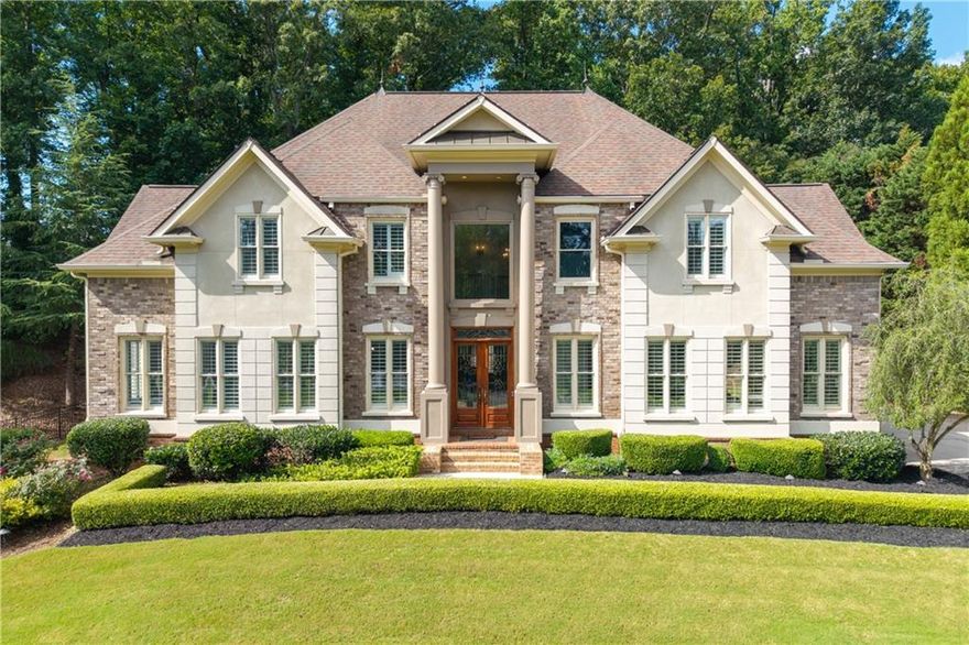 Exquisite Luxury Home in West Cobb – A Dream Residence Awaits You! Welcome to this breathtaking estate in the highly sought-after neighborhood of West Cobb. This 6-bedroom, 6-bathroom home offers unparalleled luxury, from its grand architectural design to its exquisite, newly renovated interiors. Situated on a beautifully landscaped lot, this home is perfect for those seeking the ultimate in comfort and style. As you enter you'll be immediately captivated by the dramatic two-story columns and brick steps that lead to double mahogany doors. Inside, a magnificent two-story foyer with a dome ceiling and extra-wide spiral staircase with elegant metal spindles set the tone for the rest of the home. Luxurious hardwood floors have been recently finished throughout, complemented by custom wooden plantation shutters, ensuring a warm and sophisticated ambiance. The formal dining room boasts crown molding with custom up-lighting and a recessed accent ceiling, while the formal living room offers abundant natural light and ample space for entertaining. The chef's kitchen has undergone a complete renovation, featuring gleaming quartz countertops, a Butler's cabinet/coffee bar, an island with breakfast bar, double wall ovens and a gas cooktop with a custom hidden range hood. A huge walk-in pantry and a unique circular breakfast room surrounded by windows offer serene views of the meticulously landscaped backyard. Adjacent to the kitchen, you'll find a cozy keeping room with a gas fireplace, providing the perfect setting for casual gatherings. Upstairs, the oversized primary suite is a true retreat with a tray ceiling and a spa-inspired ensuite bathroom featuring an enormous dual- shower, double vanities, a luxurious jacuzzi tub, and an expansive walk-in closet. The three additional secondary bedrooms are generously sized, each with their own ensuite bathroom featuring tiled showers and tubs. An added feature upstairs is a charming children’s retreat or flexible bonus space for extra storage. The fully finished basement reflects the same high-end finishes found throughout the main levels. It features a spacious family room with brand-new flooring, a stylish full tile bathroom, and a versatile space that was previously the sixth bedroom—now envisioned as a remarkable media room. Outfitted with elevated flooring, a projector screen, a sound system, and a bar area, it's already primed for unforgettable movie nights and entertaining. Prefer a bedroom instead? The space can be converted back to a bedroom. Think of it as your blank canvas, ready to be customized to fit your lifestyle. Step outside to your personal oasis, where a newly enclosed patio leads to a 18x36 Gunite saltwater pool, with heating capabilities, ideal for cooling off on a warm summer day or enjoying a relaxing evening swim. Enhancing the comfort and functionality of the outdoor space, right off of the kitchen, is a retractable awning providing shade and flexibility for outdoor relaxation. Additional highlights include two brand-new AC units, fresh interior paint, an irrigation system, privacy landscaping, and a Pebble Technology floor coating in the three-car garage. Ideally located in Marietta, this exceptional home provides access to some of Cobb County’s top-rated schools and is just minutes from the scenic trails of Kennesaw Mountain. You’ll also enjoy proximity to upscale shopping, fine dining, and premier entertainment at The Battery at Truist Park. Don’t miss the rare opportunity to make this stunning home yours! It’s a rare find and a must-see!