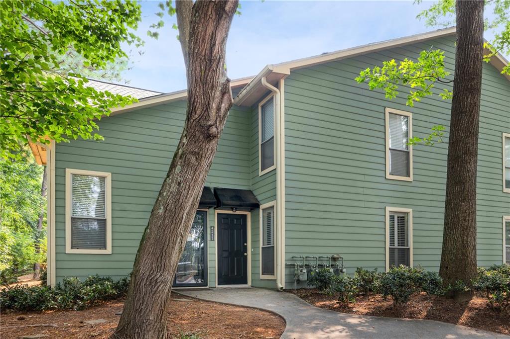 EVERYTHING IS NEW! Spacious lower level end unit 2-bed & 2-bath condo off Eves Rd in Roswell. Located in sought after Canyon Point, and surrounded by beautiful wooded views, this unit was completely remodeled in 2023! Welcoming fireplace and new flooring are inviting features to a spacious living rm w/ views to the sunroom. Upgraded designer chefs kitchen brings the granite tops, white cabinets, and SS appliances together while adding a nice textured look. Primary ste has a spacious walk-in closet, luxurious bath, and access to back patio. Community features a pool and tennis courts to unwind. Conveniently located by GA-400 & Holcomb Bridge with shopping, and dining spots.