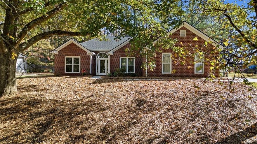UPDATED CUL-DE-SAC RANCH HOME  w/ NO HOA. Welcome home to this charming brick-front ranch with modern updates perfectly situated for convenience and comfort! Located on the cul-de-sac of a single-street neighborhood with no HOA restrictions. This home offers convenience, privacy, and flexibility. Within walking distance to Haw Creek Elementary and Lakeside Middle Schools, just ½ mile from Haw Creek Park with its playground and scenic biking and walking trails, and minutes away from a variety of waterfront parks on the shores of Lake Lanier.

Inside, you’ll find vaulted ceilings that create an open, airy feel and an updated kitchen and bathrooms featuring modern finishes. The private primary suite is thoughtfully separated from the two secondary bedrooms, offering ideal privacy. The washer and dryer are included, making this home truly move-in ready.

Enjoy outdoor living on the rear patio with a retractable awning and level, private backyard—complete with a handy storage shed. The 2-car side-entry garage plus an additional 2-car detached carport are perfect for an RV, boat storage, or extra vehicles.

With no HOA and easy access to GA-400, Market Place Blvd shopping, and Downtown Cumming, this home combines everyday convenience with exceptional flexibility.

Don’t miss this rare opportunity for single-level living in a highly desirable Forsyth County location!