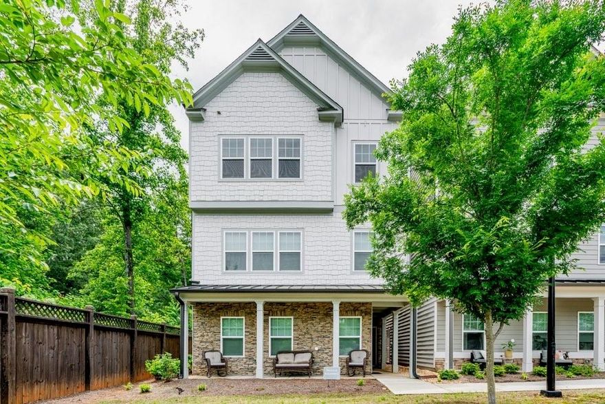Craftsman-Style Townhome Steps from Downtown Kennesaw

Discover modern comfort and classic charm in this beautifully designed 3-bedroom, 3-bath Craftsman-style townhome just minutes from downtown Kennesaw. The open-concept layout offers stylish luxury vinyl plank flooring throughout, complemented by upgraded carpet on the stairs.

The kitchen is the heart of the home, featuring a spacious center island, quartz countertops, stainless steel appliances, and a pantry for extra storage. A main-level bedroom with a full bath provides flexible space for guests or a home office.

Upstairs, the primary suite impresses with a large walk-in closet, dual vanities, and a beautifully tiled shower. A second upstairs bedroom includes its own private bath, and the laundry room is conveniently located on the same level.

Enjoy your morning coffee or unwind in the evening on the extended balcony. With a one-car garage and low-maintenance living, this home blends convenience and comfort. Just a 5-minute walk from downtown Kennesaw, you’ll have easy access to local restaurants, breweries, shops, outdoor concerts, and the area’s rich Southern history.