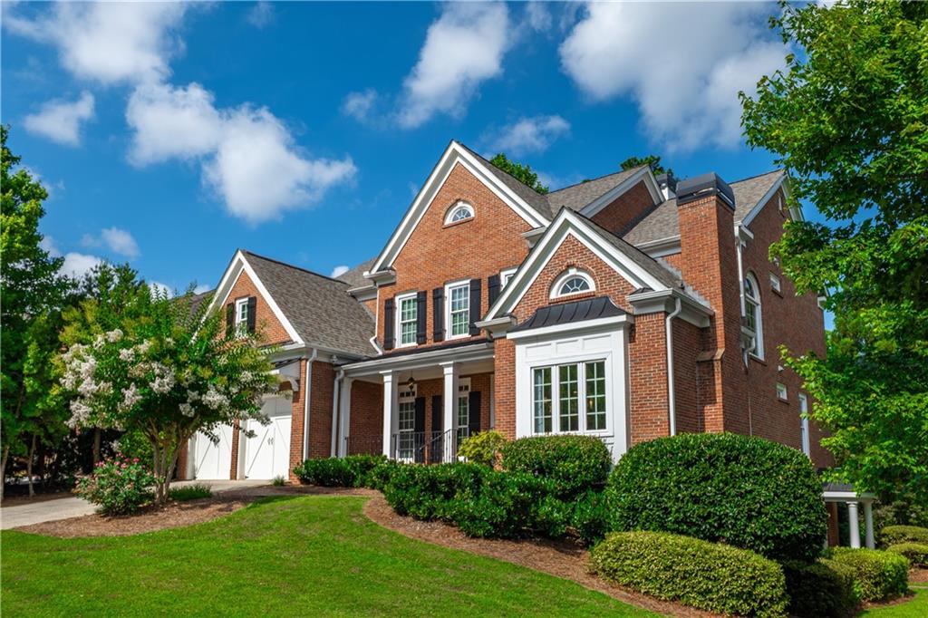 Video Link: https://youtu.be/M70a0a_rLTY
Nestled in a prestigious enclave surrounded by top-tier private schools and an acclaimed magnet high school, this east-facing, 4 sided brick masterpiece offers an unparalleled blend of elegance and extraordinary value. This meticulously updated residence is a rare opportunity to secure a luxurious lifestyle at an exceptional price in a highly coveted golf cart community. Freshly painted with new windows, brand new appliances, new HVAC, 3.5 year old roof, this home radiates sophistication and effortless living.
Step into a breathtaking two-story living room, where a dazzling chandelier illuminates soaring cathedral ceilings, custom built-in bookcases, a gas fireplace, and floor-to-ceiling windows that bathe the space in natural light. The gourmet chef’s kitchen, a culinary haven, features gleaming granite counters, stainless steel appliances—including double ovens— a breakfast bar, and an inviting breakfast room. A refined office with a fireplace and French doors, a versatile computer room with a built-in desk, a spacious bedroom, and a generously sized laundry room (complete with washer and dryer) complete this level’s seamless fusion of function and style.
Ascend to the re-stained hardwood floors of the upper level, where the oversized primary suite awaits as a private retreat. Indulge in a spa-inspired bathroom with a large shower, jetted tub, double vanities, and a cavernous closet, all beaming with glorious natural light. Two additional bedrooms, each with ensuite bathrooms, offer privacy and comfort for family or guests.
The fully finished basement, accessible via a private ground-floor entrance, is a world of its own. A full kitchen with new appliances and a dryer hookup anchors this space, complemented by a cozy den, two bedrooms, and a recreation room complete with a pool table—an ideal setting for entertaining or multigenerational living.
Outside, a screened-in patio flows effortlessly from the kitchen to a sprawling deck, with a shaded patio below, perfect for al fresco gatherings. The expansive, irrigated lot, framed by a serene tree-lined backyard, offers ample space for a pool or custom outdoor retreat, inviting endless possibilities.
Residents enjoy access to an exclusive neighborhood clubhouse featuring a pool with a waterslide, tennis courts with a pavilion, a playground, and an 18-hole golf course. With trash pickup included, this vibrant community elevates convenience and leisure to new heights.
This home is being offered at an unmatched value for the most discerning buyers who seek timeless luxury and a solid investment opportunity.
