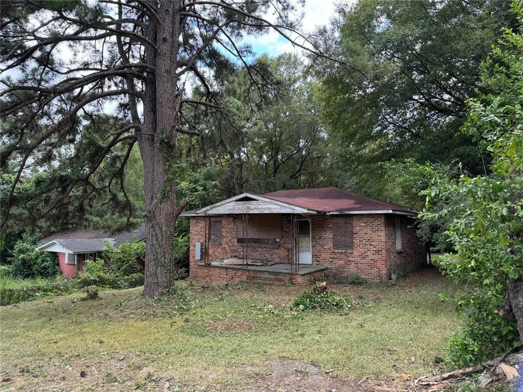 This 2 bed, 1 bath home is being sold as-is, it sits on a fantastic lot with tons of potential. Whether you're looking to renovate, rebuild, or start fresh, this property offers a prime opportunity to create your vision. Large lot with mature trees and plenty of space for expansion, gardening, or future development. Ideal for contractors, investors, or buyers with a vision. Great location — close to Mercer University, public K-12 schools and quick access to I-75. Bring your plans and make it yours!