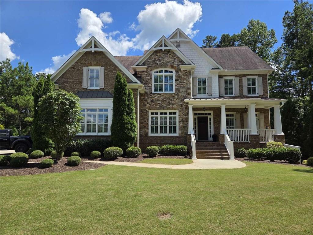 Perched on the highest point in Fulton County, this stunning brick and stone estate offers a rare combination of timeless craftsmanship, resort-style amenities, and breathtaking panoramic views. Nestled on a private, secluded 1.4-acre lot within the coveted Hampshires swim/tennis community, and zoned for the top-rated Cambridge High School district, this home is designed to impress at every turn. Step inside to a grand open floor plan that seamlessly blends sophistication with comfort. The heart of the home is the gourmet chef’s kitchen, boasting an oversized granite island, premium stainless steel appliances, and a 5-burner gas stove—perfect for both everyday living and entertaining. The sun-filled gathering room creates an inviting space for family and friends. Five spacious bedrooms and five beautifully appointed bathrooms provide plenty of room for everyone. The finished basement extends the living space with a private home theater featuring 7.1 surround sound, a recreation area, and more. Outdoors, your own private pool and flat backyard retreat offer the ultimate setting for relaxation, entertaining, or simply soaking in the serene views. A 3-car garage with custom mudroom adds convenience and function. This is more than a home—it’s a private sanctuary where luxury meets lifestyle. Don’t miss your chance to own one of the most exceptional properties in The Hampshires.