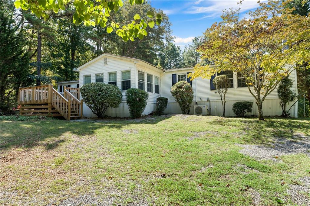 Welcome to 204 Simpson Circle! This 3 bedroom / 2 bathroom home is on a spacious .68 acre lot and is move-in ready! Upgraded master bathroom, new decks, ample lighting in the bedrooms with walk out access to the sunroom and deck, new flooring, and extra storage space in the detached garage/shop out back.