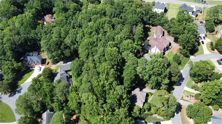 Prime Development Opportunity or Dream Home Site in Marietta

Located in one of Marietta’s most sought-after areas, this 1.82-acre parcel presents a rare opportunity for investors and homeowners alike. Just 2.5 miles from downtown Marietta, this property offers easy access to shopping, dining, festivals, and entertainment while maintaining a sense of privacy and tranquility.

For developers, this land was originally approved in 2019 for four single-family homes. The approved plat and civil plans are available for review. These plans are for reference only.  The city would need to reapprove any future development plans.

Alternatively, for those seeking to build a custom dream home, this expansive lot offers the perfect canvas. Surrounded by newly constructed luxury homes, the property provides a prime location for a private estate. The land is currently wooded, with a relatively flat front and a gentle slope in the back, making it ideal for a walk-out basement and a beautifully landscaped backyard.

Positioned just outside the highly desirable Whitlock Heights and near the entrance of Charlton Forge, this lot offers both prestige and convenience. Finding a lot like this in Marietta is rare—don’t miss your chance to make it yours!

For more details, including previous site plans and plats, contact us today.