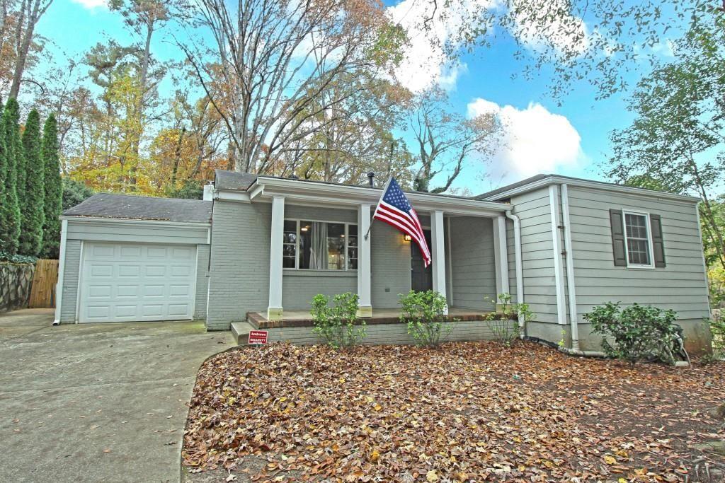 This adorable rustic cottage is the best-kept secret and deal in the sought-after Morris Brandon school district and the very desirable Ridgewood Heights neighborhood. It's close to all things FUN in the West Midtown area including Cross Creek golf course, Publix, The Works, Top Golf, tons of breweries, and more! This charming 3 bedroom, 2 bath home is move-in ready today and it sits on a deep lot that is perfect for future expansion or renovation. The Primary Bedroom includes a walk-in closet and it's own bathroom. The other 2 bedrooms share a full bath. The large family room features high ceilings, wooden beams, a decorative fireplace and wraparound windows with views of the deck and the forest of trees beyond. The open-plan living room and kitchen has an amazing flow that lets you entertain while you cook with family and friends. Recent renovations include stone steps and railing for easy access to the sidewalk, a new retaining wall, refurbished septic, refurbished exterior paint and trim, and a partially fenced back yard that is perfect for cookouts. Avid gardeners will love the flower beds and all the room for making the back yard your personal paradise. The large storage shed at the back of the yard offers great options for gardening, workshop, and other hobbies. The basement with exterior entrance provides additional storage for seasonal decorations and more. The one-car garage and large driveway provide parking for at least 3 cars and the paved turn-around makes coming and going easy and safe. It's an ideal location with easy access to I-75 and Buckhead, Downtown, and West Midtown. You're also a quick drive from the newly opened Westside Reservoir and THE WORKS where you'll find an amazing 13 acres of green space. Truly a must see location and home! New families on a budget and retirees looking to downsize will both want to check out this amazing opportunity to own a home in one of Atlanta's best communities.