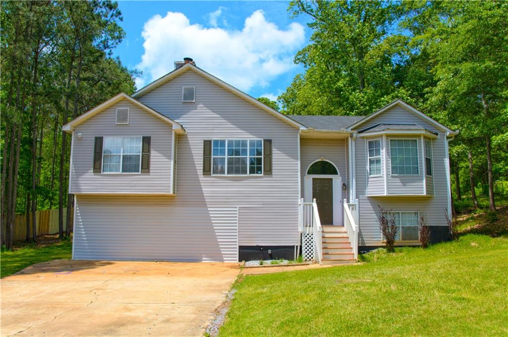Welcome Home! This Over-Sized Split Foyer Features Hardwood Floors, Finished Rooms in Basement, Huge Back Yard with Storage Building and is Located on a Single-Street Neighborhood b/t Carrollton & Bowdon. New Septic Pump, Tank & Drain Field! New HVAC!! Property is Located in USDA Eligible Area & Qualifies for 100% Financing!!
