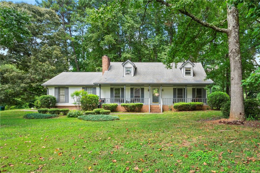 Welcome to 4665 Redspruce Drive SW a timeless 3-bedroom, 2.5-bath home nestled on a spacious, wooded lot in the heart of Lilburn. Located in the award-winning Parkview High School district, this well-maintained residence blends classic Southern charm with everyday functionality. Step inside to a warm and inviting living room filled with natural light, featuring a brick fireplace and ample space for gatherings. The separate dining room offers a traditional touch, ideal for hosting family dinners or holiday celebrations. The bright kitchen includes plenty of cabinet storage and a cozy breakfast nook. The oversized owner’s suite on the main level includes generous closet space and a private bath. Upstairs, two additional bedrooms offer flexibility for guests, a home office, or growing families. Out back, enjoy the serenity of the large fenced yard and wooded backdrop from the comfort of your private deck perfect for morning coffee or evening entertaining. Additional highlights include a rocking chair front porch and a quiet, well-established neighborhood with no HOA. Conveniently located near shopping, parks, dining, and major highways, this home offers the perfect blend of comfort and convenience.