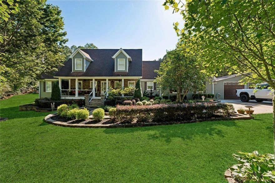 Discover resort-style living just minutes from Downtown Woodstock! This home sits on a beautifully landscaped lot with NO HOA restrictions on a quiet street shared with only two other homes, and boasts an incredible backyard oasis featuring a sparkling in-ground pool with a diving board and slide, landscape lighting, expansive patio spaces, and two HUGE covered pavilions—perfect for hosting large parties or enjoying relaxing family weekends. Plenty of parking space for vehicles, boats, an RV, and more. The home itself features hardwood floors throughout the main floor, an oversized Great Room, renovated Kitchen with custom cabinetry and granite counters, and a large Master Suite on the Main Floor. There's an additional Family Room/Den off the Kitchen that could be used for a home office, extra entertaining space, playroom, media room, and more. Upstairs includes 3 spacious bedrooms and 2 full baths. Tons of upgrades including electric window blinds on the main floor, outdoor landscape lighting, and even a built-in aquarium in the Family Room and Kitchen! With low-maintenance HardiPlank siding, a 9-year-old roof, and a 4-year-old HVAC, you'll have no worries when you move into this home—just relax and enjoy your little piece of paradise only 5 minutes from 575, 7 minutes to downtown Woodstock, and 9 minutes to the Kellogg Creek boat ramp on Lake Allatoona!