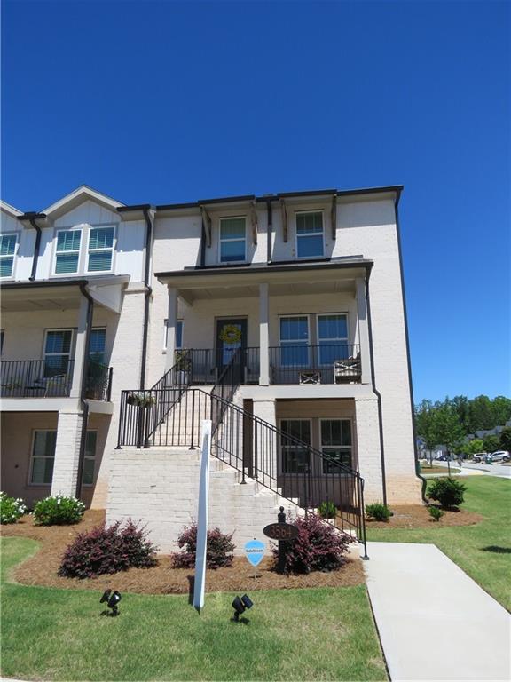 Like new, 4 bed / 3 full bath, end unit MODEL HOME! Enjoy the upgraded elegant design package with Kinsdale White Linen Cabinets and LVP throughout. Main level features stone countertops, chefs kitchen, and open living. Upstairs you will find primary with ensuite bath, two additonal rooms, and full bath. Lower level offers flex room, full bath and bedroom, perfect for guests, or an in-law-suite. The highly sought after Fairway Series at Sweetwater Green offers three-story townhomes featuring the latest design trends. Enjoy all that Lawrenceville has to offer with close proximity to shopping and dining plus convenient access to I-85 and GA-316. Planned amenities include a community clubhouse, a swimming pool and green spaces.Model home unit, built 2023, lived in since July 2024. One of four units with a full front porch and end unit side windows.