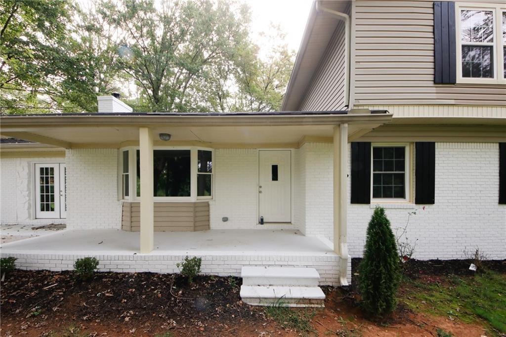 Discover this like-new 4-bedroom, 3-bath home perfectly located in the heart of Habersham County-just off Highway 115 and within walking distance to the scenic Chattahoochee River. Every detail of this beautifully renovated property has been thoughtfully updated for comfort and style. The main level features stunning new hardwood flooring, while the upper level offers plush new carpet and all bathrooms include elegant tile finishes. The kitchen and baths shine with new granite countertops, fresh cabinetry, and updated fixtures, complemented by modern lighting, recessed can lights, and stylish new interior and exterior paint. A striking new staircase with sleek metal railings adds a touch of craftsmanship that sets this home apart. Outside, the property sits on 3.97 acres, offering both privacy and convenience-with a separate two-car garage and easy access to both Highway 115 and a quiet gravel road. Enjoy a central location close to Cleveland, Clarkesville, Cornelia, Demorest, and Helen-plus shopping, restaurants, and medical facilities nearby. This home truly blends modern updates, quality workmanship, and a prime North Georgia setting. A must-see!