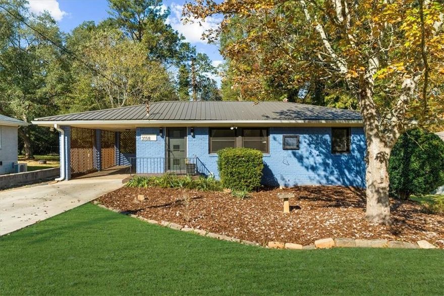 There’s something about this house. Maybe it’s the way the light hits the freshly refinished floors each morning, or how the fenced backyard seems made for lazy Sundays and muddy paws. Or maybe it’s the quiet confidence of a home that’s been lovingly cared for. A home that’s ready for its next chapter. The heavy lifting has already been done; it's been future-proofed. The impact-resistant metal roof glistens after a rainstorm, the new AC and furnace keep every season comfortable, and the updated electrical panel with EV plug means you’re set for whatever’s next. Even the details you don’t see: like the R-59 insulation, new sump pumps, and upgraded plumbing were done with longevity in mind. Inside, the 2024 kitchen renovation brought fresh life to the heart of the home, with modern updates that still honor its cozy character. The bathroom refresh adds spa-like charm, while the refinished floors tell stories of long dinners, dogs chasing toys, and quiet evenings spent at home. Downstairs, a full unfinished basement waits to become your workshop, gym, or just that extra storage space you always wish you had. Even the pups get their own corner! A built-in dog wash area makes muddy adventures part of the fun, not a chore. Set between Decatur’s dining scene and Avondale’s creative edge, this address connects you to some of Atlanta’s most beloved spots: Commune, Arepa Mia, The Stratford, and the weekend farmers market, all just a few minutes away. 3158 Robin Rd isn’t trying too hard. It just works. It’s that rare find that feels both charming and practical, effortless and full of heart. Whether you’re buying your first home, adding to your investment portfolio, or simply craving something low-maintenance and full of personality, this is the one that makes you stop scrolling and say, this feels like home