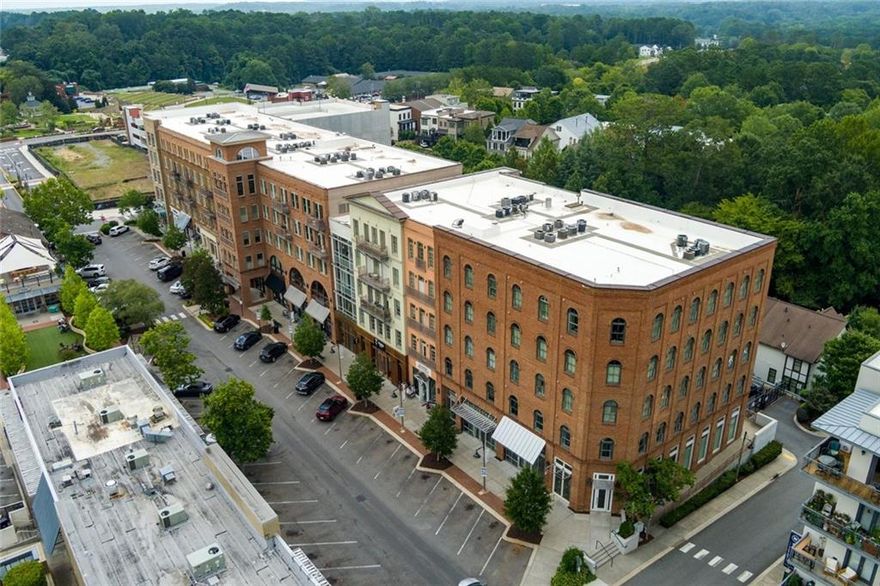 Located at 360 Chambers Street, Unit 456, in the charming city of Woodstock, GA, this attractive residential property offers a wonderful living experience. Its great condition and desirable features make it a truly special place to call home. The kitchen is a chef's dream, featuring stone countertops and crown molding that add a touch of elegance. Prepare culinary masterpieces with ease using the high-end range oven and refrigerator, while the wall chimney range hood efficiently removes any cooking odors. The large kitchen island provides ample space for meal preparation and casual dining, while the backsplash adds a stylish focal point. The kitchen bar offers a comfortable spot for guests to gather and enjoy refreshments. The bathrooms exude spa-like tranquility, each designed with meticulous attention to detail. One bathroom features a tiled walk-in shower, while the other boasts a tile tub, providing options for relaxation. The bedrooms offer private retreats, each adorned with crown molding, adding a touch of sophistication. The ensuite bathroom provides added convenience. The living room is an inviting space, enhanced by crown molding, creating an atmosphere of refined comfort. Step outside onto the balcony and savor the serenity of the woods view, a peaceful backdrop to your daily life. This property offers a harmonious blend of comfort and style in a desirable residential area.