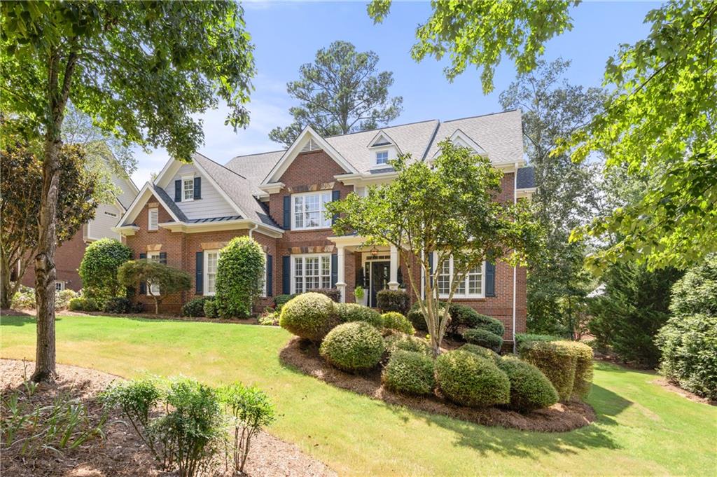 Welcome home to this impeccably maintained and loved four-sided brick 6-bed and five full bath home designed for casual elegance! Stunning main level boasts an inviting foyer flanked by the formal living and dining rooms and leading to the family room, all with gleaming new hardwood floors and gorgeous windows. The fully updated chefs' kitchen offers gathering space around the fireplace and spacious breakfast area overlooking the private deck and backyard. The main level guest bedroom with full bath offers great flexibility for family and friends, short- or long-term guests will always feel welcome. All lighting, plumbing fixtures and finishing work are updated and spectacular. Yes, a designer lives here!
With its expansive square footage, this home provides room for everyone. Upstairs offers the ideal decadent owners' retreat, spa-like bathroom with huge soaking tub, separate vanities and roomy shower, custom closet gives you ample space to be organized and display everything easily, so mornings are a breeze! Owners' bedroom offers a spacious sitting area and time to just relax and enjoy your moment. Three additional bedrooms with two full baths and an enormous flex room give everyone plenty of space for their varied interests. The terrace level is an entertainers' dream with a private bedroom and bath with walk-in shower, huge family room offering space for every game table or setup you can dream of, private theater room, extensive storage, and direct access to the patio and backyard with playset and built-in firepit to enjoy evenings under the stars! Both the two-car garage and one-car garage are at kitchen level so loading and unloading is always a breeze.
This fine home is situated on a quiet double-cul de sac street and offers the perfect balance of luxury, comfort, and convenience. Neighbors enjoy many seasonal activities together!
With its expansive square footage, this home provides room for everyone.
Enjoy the unbeatable location: just a short walk or golf cart ride to nearby restaurants, shopping, and amenities, yet tucked away on a quiet street for peace and privacy. This is more than a home—it’s a lifestyle.
Don’t miss your chance to own this designer dream home in one of Acworth’s premier neighborhoods. There is absolutely no to-do list here, move right in and start living the good life!