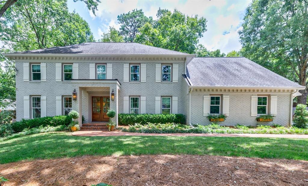 Completely redesigned and reimagined in the highly sought after Branches Swim/Tennis community, this stunning home offers a down-to-the-studs renovation with over $450,000 in custom upgrades and designer finishes. Tucked away on a quiet cul-de-sac, this painted four-sided brick home sits on a large, private lot featuring a portico addition and a fabulous fenced backyard with walkout brick patio, fire pit, and room for a pool. Inside, the bright and open floorplan is filled with natural light and custom details including archways, built-ins, designer lighting, wide plank hardwood flooring up/down, and recessed lighting throughout. The kitchen and dining area open to a vaulted great room features a T&G ceiling with beams and a floor-to-ceiling gas fireplace. New doors and double-pane windows have been installed throughout, including high-end sleek dual iron and glass doors which seamlessly lead to the backyard.
The completely renovated and expanded kitchen is a showstopper, opening to a keeping room and features custom soft-close cabinetry, extensive built-ins including hidden coffee and appliance centers, quartzite waterfall island with seating, a farmhouse sink, and a full suite of premium appliances—Wolf gas cooktop, built-in refrigerator, double ovens, dual beverage drawers, a premium integrated wine cooler, and more! A separate bar area/butler’s pantry makes entertaining a delight! The spacious primary suite offers a brand-new spa-inspired bath with oversized glass-enclosed shower, new dual vanity, built-in shelving for baskets, and a large walk-in closet with full organization system. Additional highlights include newly designed bathrooms throughout, an expanded bedroom with built-in beds and drawers, a laundry/mudroom with built-ins and bench seating, and a finished basement with entertainment room and additional storage/flex space. Located close to GA-400, Dunwoody Village, Perimeter, and top-rated public and private schools, this move-in ready home is the perfect blend of luxury, functionality, and location!