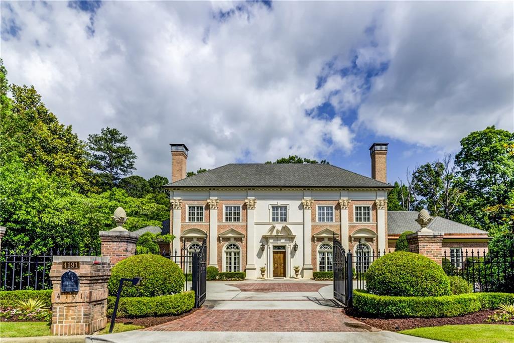 Grand traditional home on gated 1.5 acre cul-de-sac lot by architect William T. Baker. Features in ground heated pool, oversized entertaining spaces, and 2 owner suite options with new flooring. 2 story foyer & great room, formal living & dining rooms, fireplaces, 10+ foot ceilings, and abundant natural light. Open floor plan kitchen, high end SS appliances & view to family room. Owner suite on main with sitting room, en suite with sep tub/shower & double vanity. Upstairs owner suite with fully renovated en suite, study & wet bar. Theatre, gym, 4+ car garage, pool house