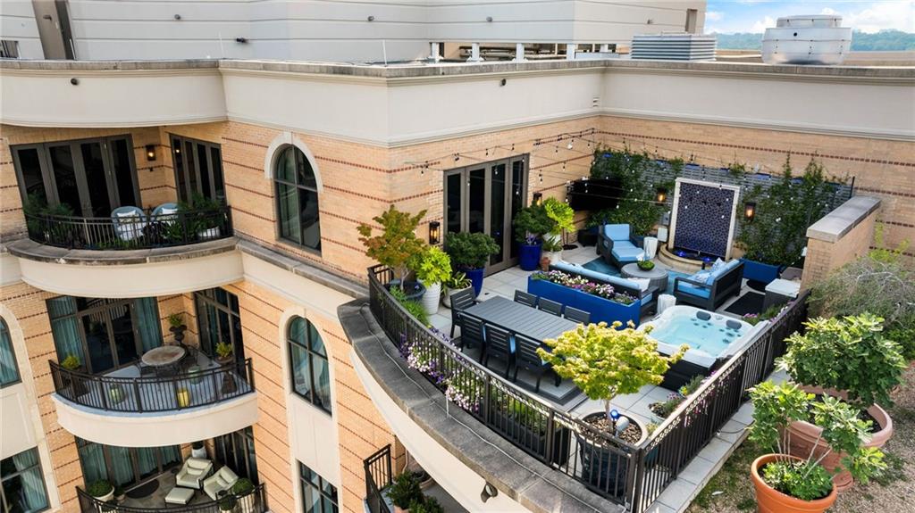 Modern Elegance in the Sky – Designer Penthouse with Multiple Terraces
Step into a world of refined sophistication with this extraordinary penthouse, the builder’s personal masterpiece, fully reimagined with no expense spared. Perched atop the exclusive Borghese—a boutique building with just 55 owner-occupied residences—this 3-bedroom, 2.5-bath home offers nearly 4,000 square feet of breathtaking, custom-designed luxury.
From the moment you enter, soaring barrel-vaulted ceilings and expansive open living spaces welcome you with an air of modern elegance. Two private terraces invite seamless indoor-outdoor living, complete with a tranquil water feature and an inviting hot tub—your perfect retreat in the sky.
The chef’s kitchen is a culinary dream, featuring all commercial-grade Viking appliances including an 8-burner gas range, a freestanding climate-controlled glass and steel 240-bottle wine cabinet, a dual-zoned wine and beverage center, and even a nugget ice machine at the bar. The separate catering entrance makes entertaining effortless.
The luxurious primary suite is a private sanctuary with a sleek and modern fireplace, spa-inspired steam shower with aromatherapy, and expansive custom closets designed with elegance and function in mind. Every detail has been thoughtfully curated—from white oak floors, 3M heat/cool-resistant window film on all custom steel and glass doors and windows and phantom screens to a state-of-the-art lighting and shade system.
Additional highlights include:
• Three deeded parking spaces conveniently located next to the elevator with an EV charger
• A private storage unit on the penthouse level
• Full home automation system for modern convenience
Living at The Borghese means enjoying five-star amenities: 24-hour concierge service, a fully equipped gym, saltwater pool, massage room, two luxurious guest suites, meeting room, library and a community lounge with a full kitchen.
This one-of-a-kind residence delivers the scale and sophistication of a custom estate—elevated by panoramic skyline views and the ease of lock-and-leave living.
Do not miss the rare opportunity to own this stunning penthouse in the sky!