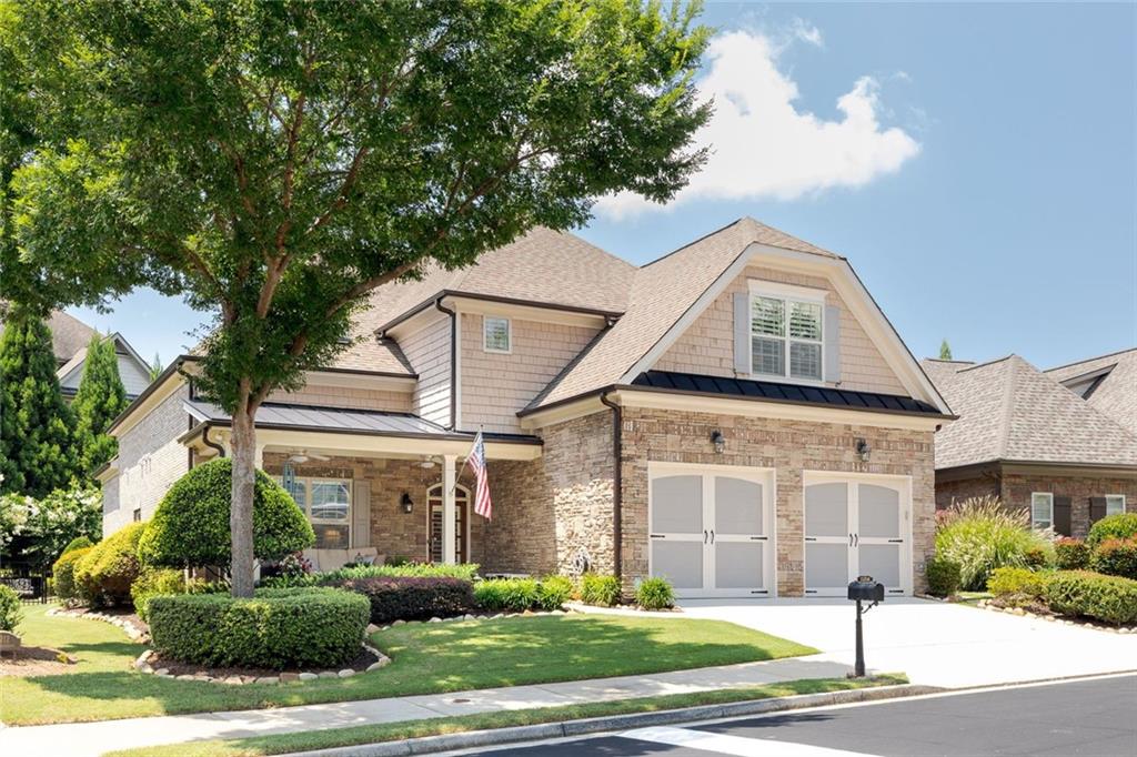 Welcome home to comfort, style, and convenience! Seller has invested over $100,000 in remodeling and
you will love the elegance and meticulous maintenance of this home in Brookhaven at Johns Creek, an award-winning Active Adult 55+ Community. This modified Ansley I floor plan is spacious and well-designed. You’ll appreciate the many updates. MAIN LEVEL: New hardwoods throughout main level. Private OFFICE/STUDY offers great natural light overlooking the front porch. Elegant coffered ceiling and pocket doors. This office can “double” as a bedroom with the adjacent full bath. The open-concept floor plan connects the family room, dining area, and kitchen - wonderful for entertaining friends and family. LIVING ROOM features a gas fireplace flanked by built-in bookcases. KITCHEN has been wonderfully updated with creamy cabinetry and newer appliances: wine refrigerator, gas cooktop, microwave, refrigerator, dishwasher. Durable quartzite Taj Mahal countertops. Undercabinet task lighting. The DINING area is open and can comfortably seat eight guests. The LANAI has been remodeled to a heated/cooled SUNROOM with new windows, and built-in bookcases. The stacked stone fireplace makes this a cozy place for watching television, enjoying a good book, or chatting with friends. PRIMARY SUITE is very spacious and features a frameless walk-in shower, double-sink vanity with granite countertops, and a linen tower for all your essentials. Custom closet provides efficient storage. Walk-out from the main level to a private and tranquil oasis! Large flagstone patio, gazebo, and gorgeous landscape all combine to create a feeling of peace, privacy and well-being. UPSTAIRS: Another master/guest suite. This area is very versatile with a sitting room, sleeping area, cozy reading nook, TV/conversation area and a private full bath. You’ll really appreciate the heated/cooled auxiliary room with sky light and built in cabinets. Perfect for an occasional bedroom or additional storage. Beyond the home, the community offers resort-like amenities: swimming pool, nature trail, lighted and newly resurfaced tennis court and (2) PICKLEBALL courts, community garden and Clubhouse. The Clubhouse features a fitness center, library, pool table, meeting space and two kitchens. Convenient to shopping, medical care, country clubs and restaurants. You will LOVE the lifestyle of ease and enjoyment offered with this home in this community.