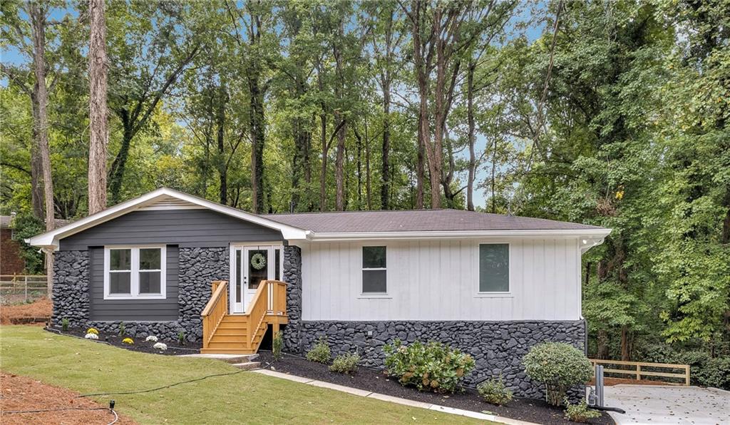 Experience modern, comfortable living in this beautifully renovated 4-bedroom, 3-bathroom in a family friendly neighborhood in Marietta, Georgia. Enjoy a fully renovated kitchen featuring a gorgeous island, quartz countertops with a custom finish, and brand-new stainless steel appliances. The fully refinished basement includes a fourth bedroom and a full bath, plus an additional room perfect for a home office. This home has a lot to offer , including all new interior and exterior paint, all new flooring, and not to mention the perfect light fixtures. Sitting in a large lot full of beautiful trees surrounded by nature. Perfect for family gatherings to make wonderful memories. The outdoor deck offers stunning views of the picturesque nature surrounding the home. Don’t miss the chance to see this beautiful property! Schedule your visit today!